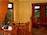 Dining Room in Johnny B's Irish Bed & Breakfast accommodation -  also showing conservatory